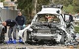 Illustrative photo of police inspecting the aftermath of a car bombing near Tel Aviv, on January 19, 2016. (Flash90)