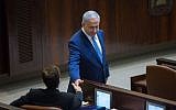 Prime Minister Benjamin Netanyahu shakes hands with opposition leader Isaac Herzog during a special plenum session marking the 50th anniversary of the Knesset, January 19, 2016. (Yonatan Sindel/Flash90)