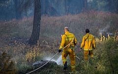 Illustrative photo of firefighters extinguishing a forest fire, April 25, 2016. (Basel Awidat/Flash90)