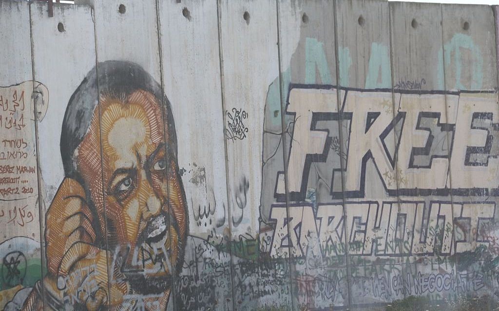 An image of Marwan Barghouti is seen painted on the security fence near the West Bank village of Qalandiya on May 6, 2016. (Photo by Haytham Shtayeh/Flash90) An image of Marwan Barghouti is seen painted on the security fence near the West Bank village of Qalandiya on May 6, 2016. (Photo by Haytham Shtayeh/Flash90)