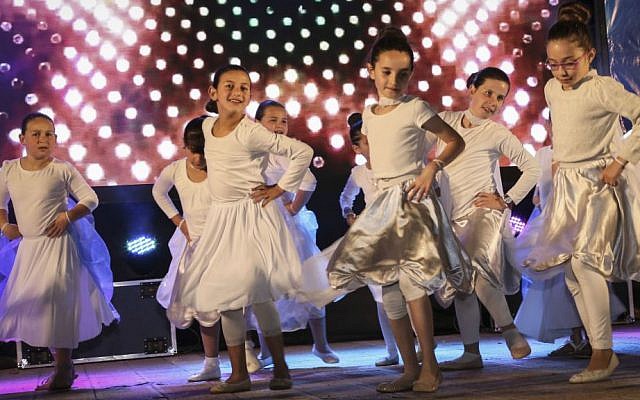 Israeli children celebrate Israel's 68th Independence Day in the West Bank settlement of Efrat, May 11, 2016. (Gershon Elinson/Flash90) Israeli children celebrate Israel's 68th Independence Day in the West Bank settlement of Efrat, May 11, 2016. (Gershon Elinson/Flash90)