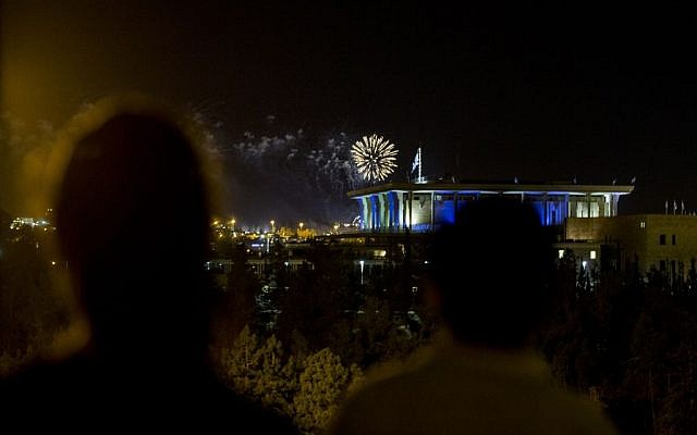 Fireworks from the Mount Herzl ceremony seen over the Knesset in Jerusalem, marking the beginning of celebrations of Israel's 68th Independence Day, May 11, 2016. (Yonatan Sindel/Flash90)
