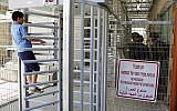 Illustration. Palestinian students protest at a checkpoint entrance in the divided West Bank city of Hebron on May 12, 2016. (Wisam Hashlamoun/FLASH90)