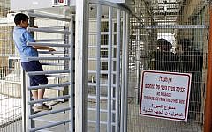 Illustration. Palestinian students protest at a checkpoint entrance in the divided West Bank city of Hebron on May 12, 2016. (Wisam Hashlamoun/FLASH90)