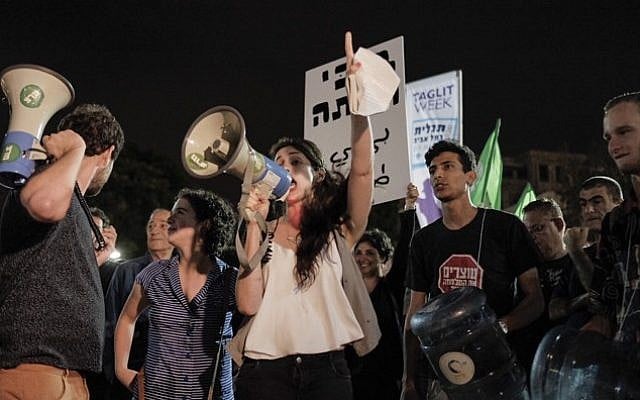 Protesters demonstrate against the appointment of Yisrael Beytenu head Avigdor Liberman as defense minister, at Habima Square in central Tel Aviv, on May 21, 2016. (Tomer Neuberg/Flash90) Protesters demonstrate against the appointment of Yisrael Beytenu head Avigdor Liberman as defense minister, at Habima Square in central Tel Aviv, on May 21, 2016. (Tomer Neuberg/Flash90)