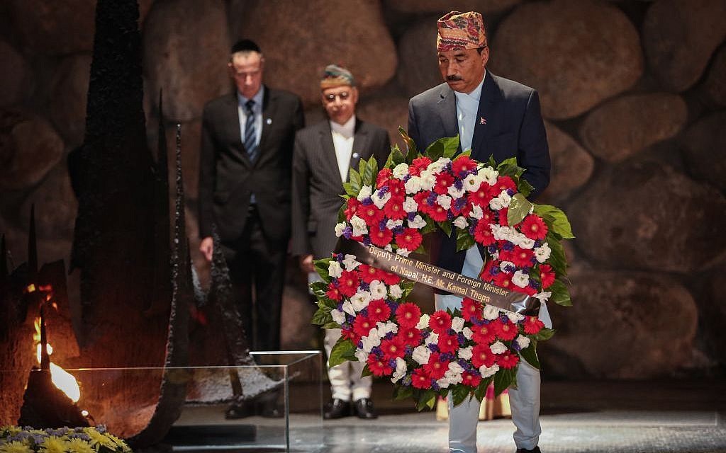 Deputy Prime Minister and Foreign Minister of Nepal, Kamal Thapa, lights the memorial torch during his visit to the Yad Vashem Holocaust Museum, in Jerusalem, on May 25, 2016. (Photo by Flash90) Deputy Prime Minister and Foreign Minister of Nepal, Kamal Thapa, lights the memorial torch during his visit to the Yad Vashem Holocaust Museum, in Jerusalem, on May 25, 2016. (Photo by Flash90)