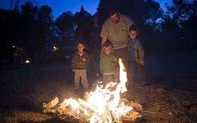 Jews seen near a big bonfire, during celebrations of the Jewish holiday of Lag Baomer in Jerusalem on May 25, 2016. Lag Baomer commemorates the death of Rabbi Shimon Bar Yochai, one of the most important sages in Jewish history 1800 years ago. The most well-known custom of Lag BaOmer is the lighting of bonfires throughout Israel and in Jewish communities worldwide. (Yonatan Sindel/Flash90)