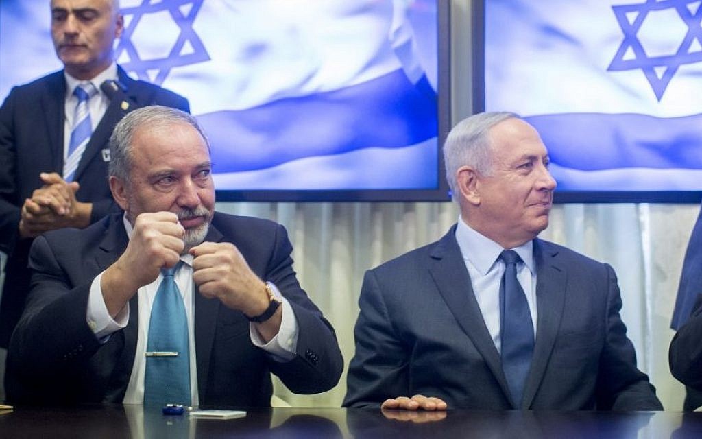 Prime Minister Benjamin Netanyahu, right, and leader of the Yisrael Beytenu political party Avigdor Liberman sign an agreement bringing Liberman's party into the government, May 25, 2016. (Yonatan Sindel/FLASH90) Prime Minister Benjamin Netanyahu, right, and leader of the Yisrael Beytenu political party Avigdor Liberman sign an agreement bringing Liberman's party into the government, May 25, 2016. (Yonatan Sindel/FLASH90)