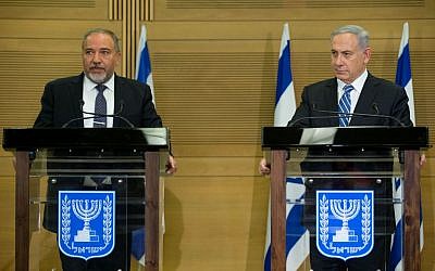 Prime Minister Benjamin Netanyahu (right) and incoming Defense Minister Avigdor Liberman (left) hold a press conference in the Knesset on Monday, May 30, 2016. (Yonatan Sindel/Flash90)