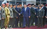 Avigdor Lieberman shakes hands with the military general staff during a welcoming ceremony at the Defense Ministry in Tel Aviv, on May 31, 2016. (Flash90)