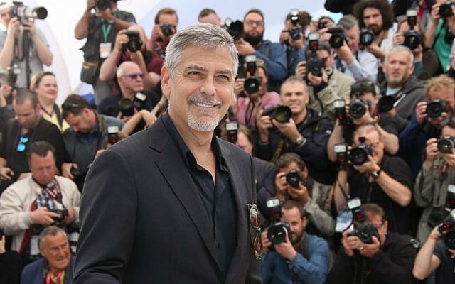 Actor George Clooney poses for photographers during a photo call for the film 'Money Monster' at the 69th international film festival, Cannes, France, May 12, 2016. (AP/Thibault Camus) Actor George Clooney poses for photographers during a photo call for the film 'Money Monster' at the 69th international film festival, Cannes, France, May 12, 2016. (AP/Thibault Camus)