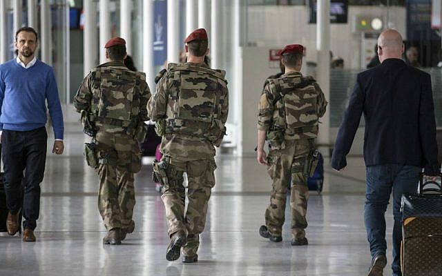French soldiers patrol at Charles de Gaulle airport, outside of Paris, Friday, May 20, 2016. (AP Photo/Laurent Cipriani)