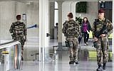 French soldiers patrol at Charles de Gaulle airport, outside of Paris, Friday, May 20, 2016. (AP Photo/Laurent Cipriani)