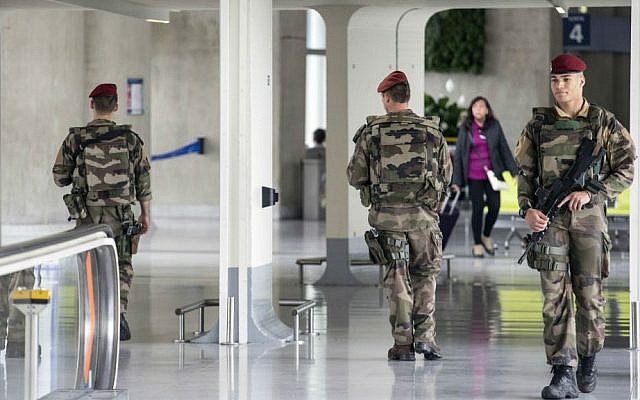 French soldiers patrol at Charles de Gaulle airport, outside of Paris, Friday, May 20, 2016. (AP Photo/Laurent Cipriani)