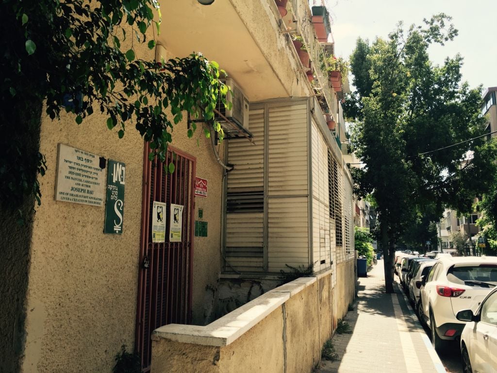 The Joseph Bau House on Holocaust Remembrance Day 2016, located on Berdichevski Street in Tel Aviv, one of the more dilapidated buildings on a street of renovated Bauhaus homes (Jessica Steinberg/Times of Israel)