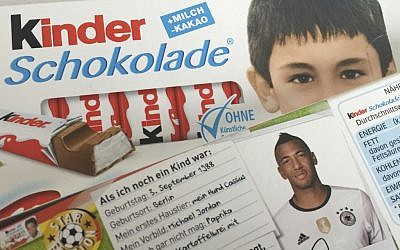 Packages of 'Kinder' bars a short bio of national soccer player Jerome Boateng and a childhood picture of Ilkay Gundogan, May 25, 2016. (AP Photo/Ferdinand Ostrop)