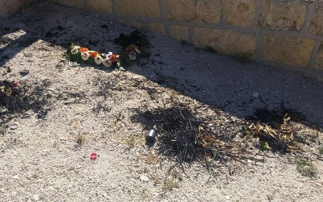 Wreaths that were destroyed and burned at the Mount of Olives cemetary in Jerusalem on Thursday, May 12, 2016 (Israel Police) Wreaths that were destroyed and burned at the Mount of Olives cemetary in Jerusalem on Thursday, May 12, 2016 (Israel Police)