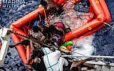 In this photo taken in the Mediterranean Sea, off the Libyan coast, Friday, May 27, 2016 rescuers help migrants to board the Italian Navy ship Vega, after the boat they were aboard sunk.(Raffaele Martino/Marina Militare via AP Photo)
