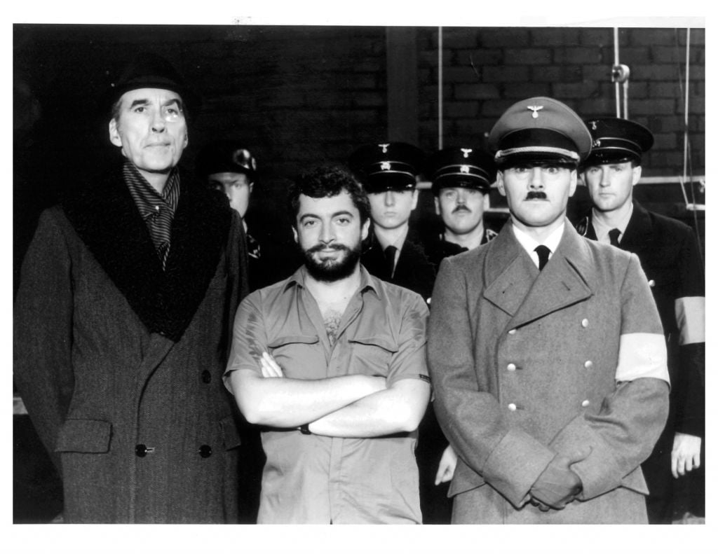 Mora, center, with the actors portraying Hitler and the SS on the set of his 1983 movie 'The Return of Captain Invincible' (courtesy) Mora, center, with the actors portraying Hitler and the SS on the set of his 1983 movie 'The Return of Captain Invincible' (courtesy)