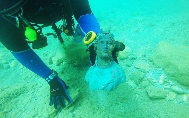 A figurine of the moon goddess Luna as discovered on the seabed at the site of the ancient sea port of Caserea, Israel. (Ran Feinstein)