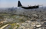 A C-130J Super Hercules cargo plane flies over Tel Aviv's Hayarkon River as part of the Israeli Air Force's annual flyby on Independence Day, May 12, 2016. (Judah Ari Gross/Times of Israel)
