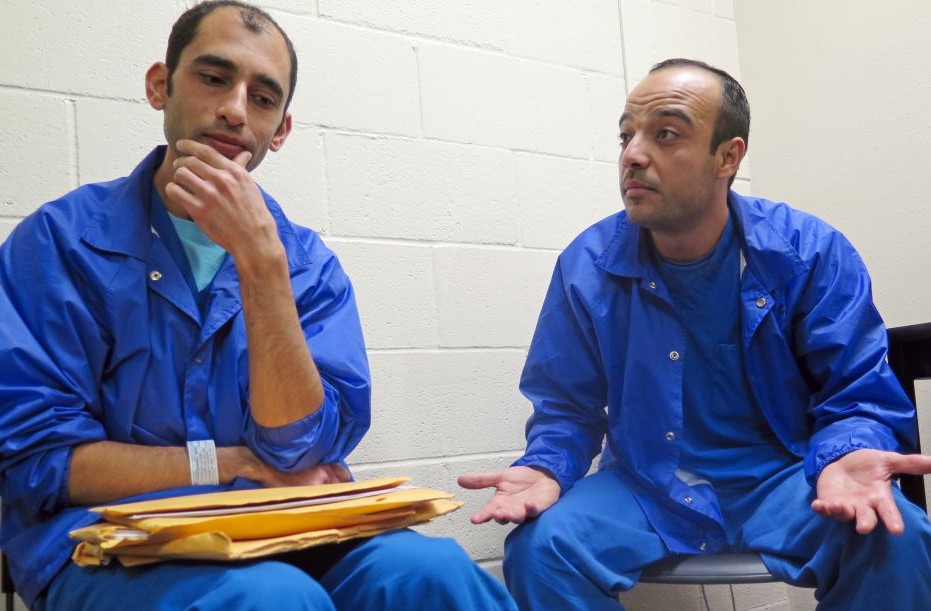In this Thursday, December 10, 2015 photo, Mounis Hammouda, left, and Hisham Shaban sit in a small room at an immigration detention center in Eloy, Arizona (AP Photo/Astrid Galvan)