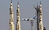An EgyptAir plane flies past minarets of a mosque as it approaches Cairo International Airport, in Cairo, Egypt, Saturday, May 21, 2016. (AP Photo/Amr Nabil)