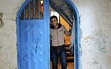 In this Tuesday, May 10, 2016 photo, Mohammed Al-Hissi, 25, who won a scholarship for a Master's program in physics at the University of Triesta in Italy, poses for a photo at his family home in Gaza City. (AP Photo/Adel Hana)