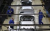 Iranian car workers assemble cars at the state-run Iran Khodro automobile manufacturing plant, just outside Tehran, Iran, April 25, 2015 (AP Photo/Vahid Salemi)