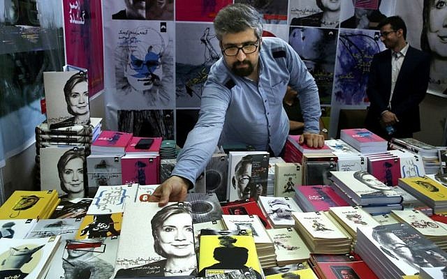 In this picture taken May 10, 2016, a book seller arranges US presidential candidate Hillary Clinton's book "Hard Choices" translated to Persian during Tehran's International Book Fair in Iran. (AP Photo/Vahid Salemi) In this picture taken May 10, 2016, a book seller arranges US presidential candidate Hillary Clinton's book "Hard Choices" translated to Persian during Tehran's International Book Fair in Iran. (AP Photo/Vahid Salemi)