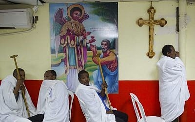 In this Saturday, May 7, 2016 photo, Eritrean Christian Orthodox migrants attend a mass at a makeshift church in Tel Aviv, Israel. (AP Photo/Oded Balilty)