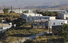 This May 18, 2016 photo shows buildings in Amona, an Israeli settlement outpost in the West Bank, east of Ramallah. (AP Photo/Oded Balilty)