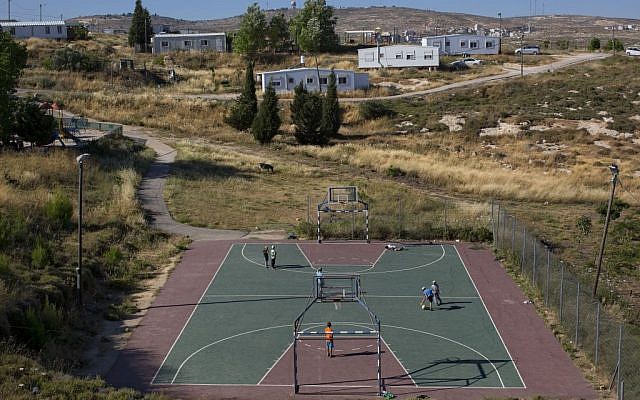 In this Wednesday, May 18, 2016 photo, Jewish youths play soccer in Amona, an Israeli outpost in the West Bank, east of the Palestinian town of Ramallah. (AP Photo/Oded Balilty)