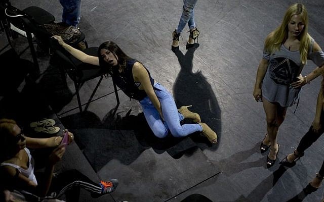In this Sunday, May 22, 2016 photo, contestants in the first Miss Trans Israel beauty pageant, rest during rehearsal in Tel Aviv, Israel. (AP Photo/Oded Balilty)
