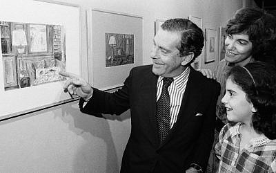 Morley Safer points to one of his watercolors displayed at a New York restaurant as his wife Jane and daughter Sarah look on. (AP Photo/ Richard Drew, File)