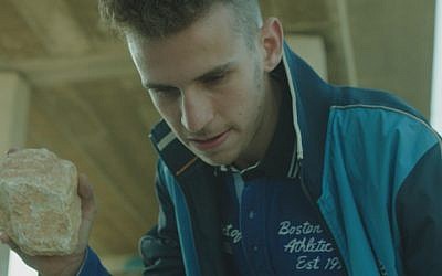 Noam Imber stars as David's son Omri in Eran Kolirin’s latest film, 'Beyond the Mountains and Hills' (screenshot)