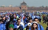 Participants of the yearly March of the Living walk in the former German Nazi Death Camp Auschwitz-Birkenau, in Brzezinka, Poland, May 5, 2016. (AP Photo/Alik Keplicz)