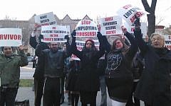 Orthodox activists, like these protesting outside a Brooklyn yeshiva on May 3, 2016, are asking institutions to do more to report and investigate allegations of child sexual and physical abuse. (Courtesy of Chaim Levin via JTA)