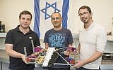 (L to R) Igor Kantor, Koby Kohai and Eli Zalianski hold their robot xylophone player (Shitzu Photographers, Technion Spokesperson’s Office)