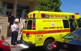 An ambulance outside of apartment where a couple was found shot to death on Pika street in Rishon Lezion, on May 25, 2016. (screen capture: Ynet)