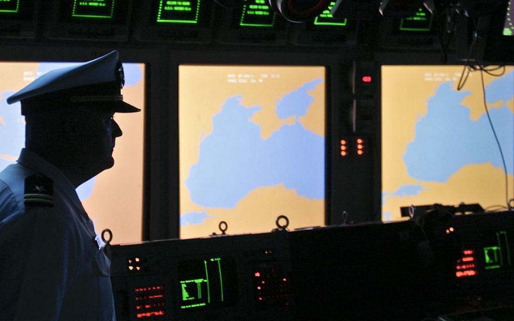 In this Tuesday, June 7, 2011 file photo, a US Navy officer, name not available, stands on the weapons control deck of the USS Monterey as screens display the Black Sea region, in the Black Sea port of Constanta, Romania. (AP Photo/Vadim Ghirda, File)