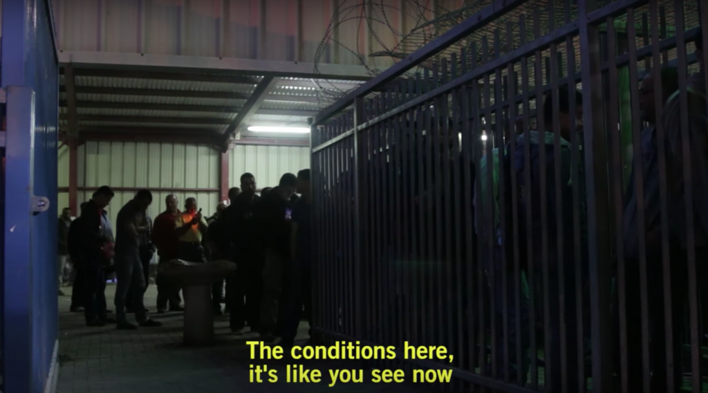 Screen shot of Palestinian laborers on May 3, 2016 waiting to enter the metal cage-like passageway that leads into area where IDs are checked. (Luke Tress / Times of Israel) Screen shot of Palestinian laborers on May 3, 2016 waiting to enter the metal cage-like passageway that leads into area where IDs are checked. (Luke Tress / Times of Israel)