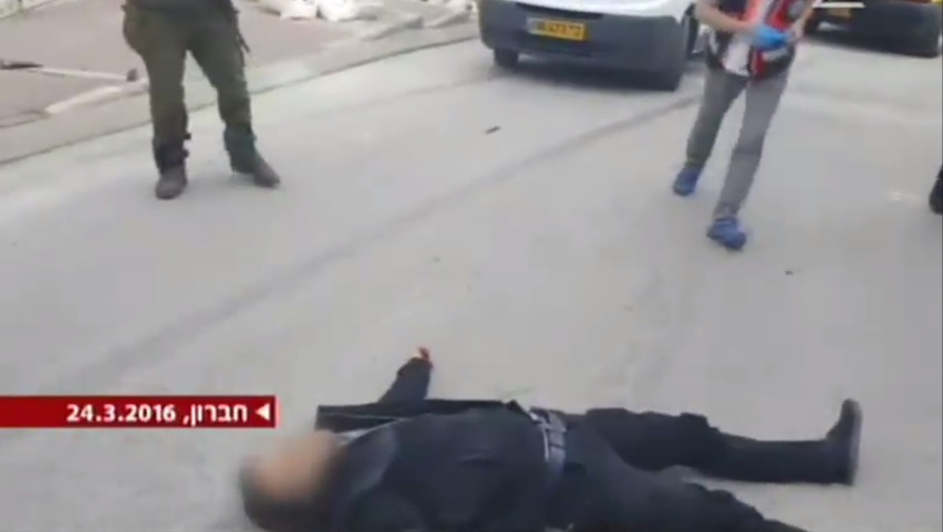 A wounded assailant lying some distance from a knife in Hebron on March 24, 2016 (Channel 2 screenshot) A wounded assailant lying some distance from a knife in Hebron on March 24, 2016 (Channel 2 screenshot)