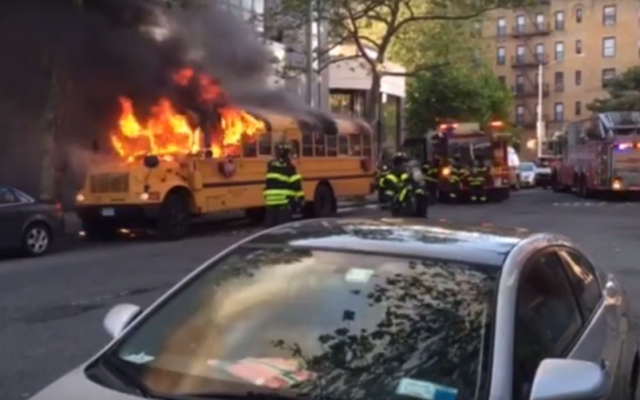 A bus in flames on May 8, 2016 in front of the Beth Rivkah School for Girls in Crown Heights, Brooklyn (screen capture: YouTube) A bus in flames on May 8, 2016 in front of the Beth Rivkah School for Girls in Crown Heights, Brooklyn (screen capture: YouTube)