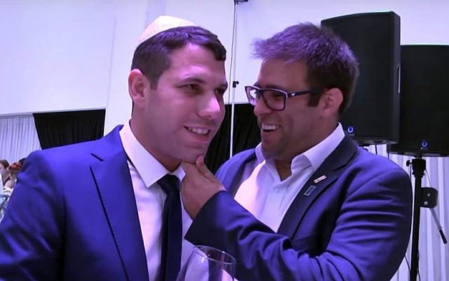 Moshe Ben-Zaken, left, celebrates his son's circumcision with MK Oren Hazan, right. (Screen capture: YouTube) Moshe Ben-Zaken, left, celebrates his son's circumcision with MK Oren Hazan, right. (Screen capture: YouTube)