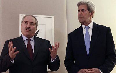 US Secretary of State John Kerry, right, listens as Jordanian Foreign Minister Nasser Judeh, talks to the media during a bilateral meeting on Syria in Geneva, Switzerland, Sunday, May 1, 2016. (Denis Balibouse/Pool via AP)