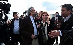 Journalist Can Dundar, center, and his wife Dilek look on just after the attack on Can Dundar outside city's main courthouse in Istanbul, Friday, May 6, 2016. (Can Erok, Cumhuriyet via AP)
