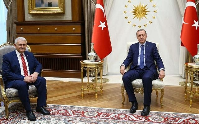 Turkey's President Recep Tayyip Erdogan, right, and Binali Yildirim, the ruling party's new chairman, pose for a photograph at the presidential palace in Ankara, Turkey, Sunday, May 22, 2016. (Presidential Press Service, Pool via AP Photo) Turkey's President Recep Tayyip Erdogan, right, and Binali Yildirim, the ruling party's new chairman, pose for a photograph at the presidential palace in Ankara, Turkey, Sunday, May 22, 2016. (Presidential Press Service, Pool via AP Photo)