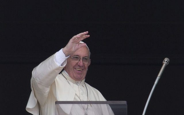 Pope Francis waves during the Regina Coeli prayer from his studio's window overlooking St. Peter's Square, at the Vatican,May 1, 2016. (AP Photo/Alessandra Tarantino)