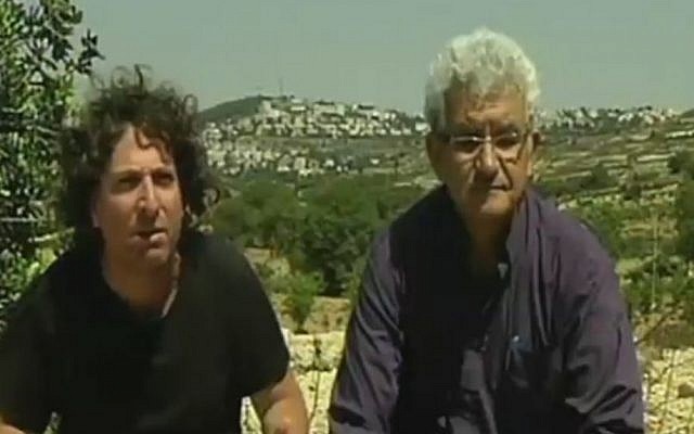 Jewish settler Eliaz Cohen, left, and PLO member Muhammad Beiruti sit together near Efrat, in the West Bank. The two are members of the new movement Two States, One Homeland. (Screen capture Channel 2)
